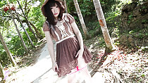 Ayame standing on trail playing with hem of dress panties down around her knees