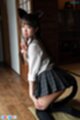 Ria kurumi kneeling in short skirt looking over her shoulder